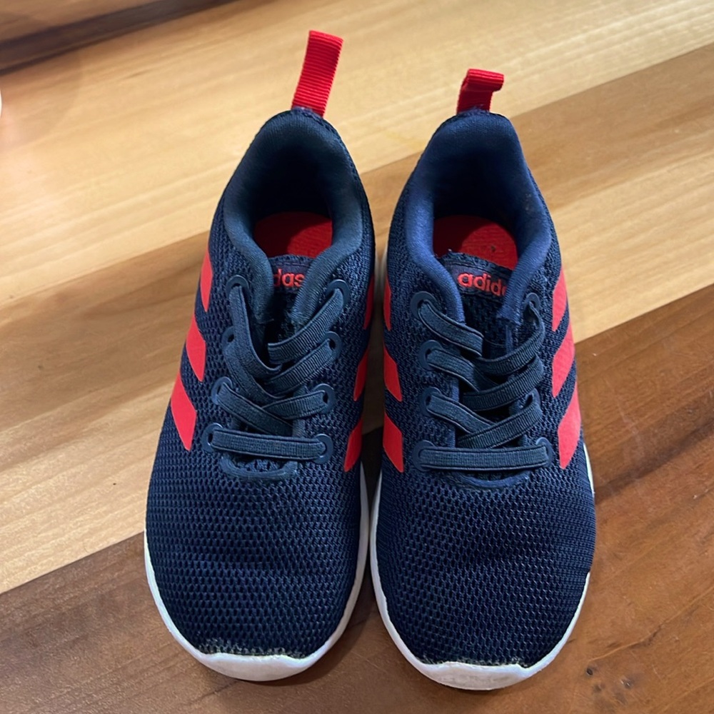 Toddlers, black and red Adidas sneakers